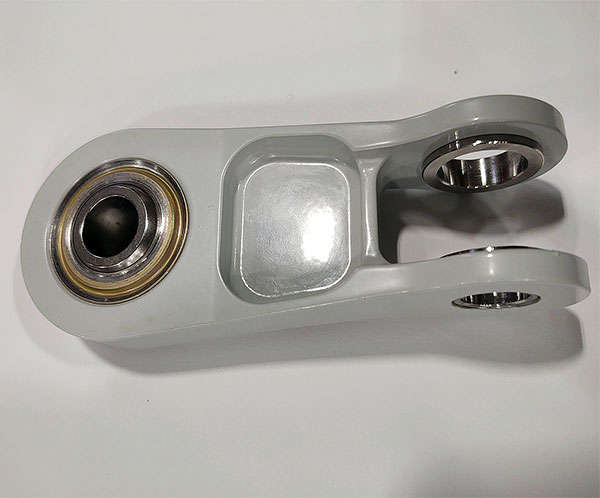An image of a white ball bearing on a white surface.