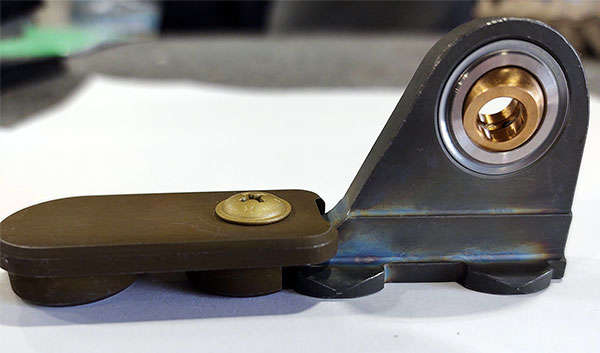 A piece of metal with a knob on it.