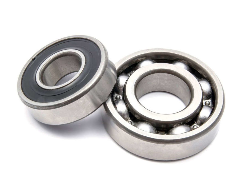 Two ball bearings on a white background, demonstrating bushing installation.